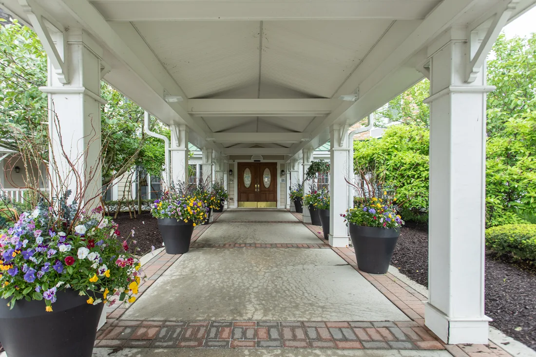 Orchard Hill entry way with very large flower pots full of perennials